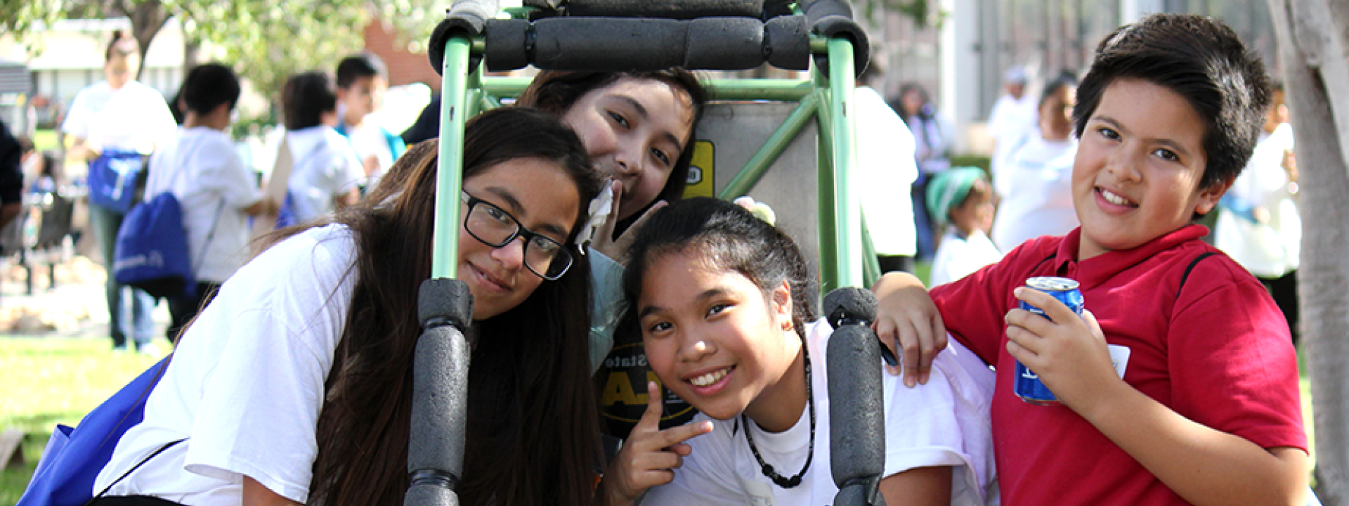 smiling kids in baja car